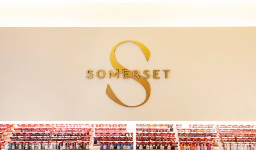 Gold Somerset monogram on the wall